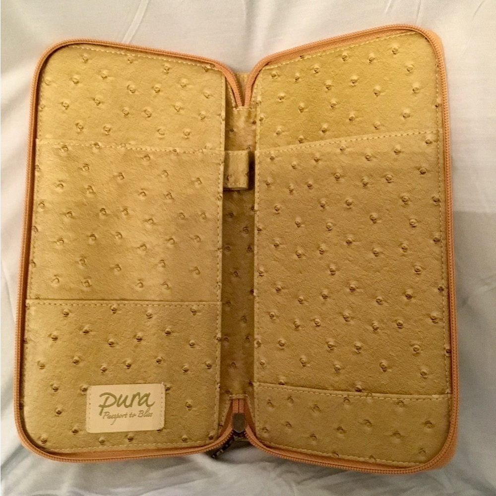 PURA Traveling Clutch, ostrich leather, 10”H x 5 1/2”W when closed, goldtone